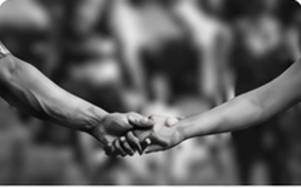 Two people holding hands